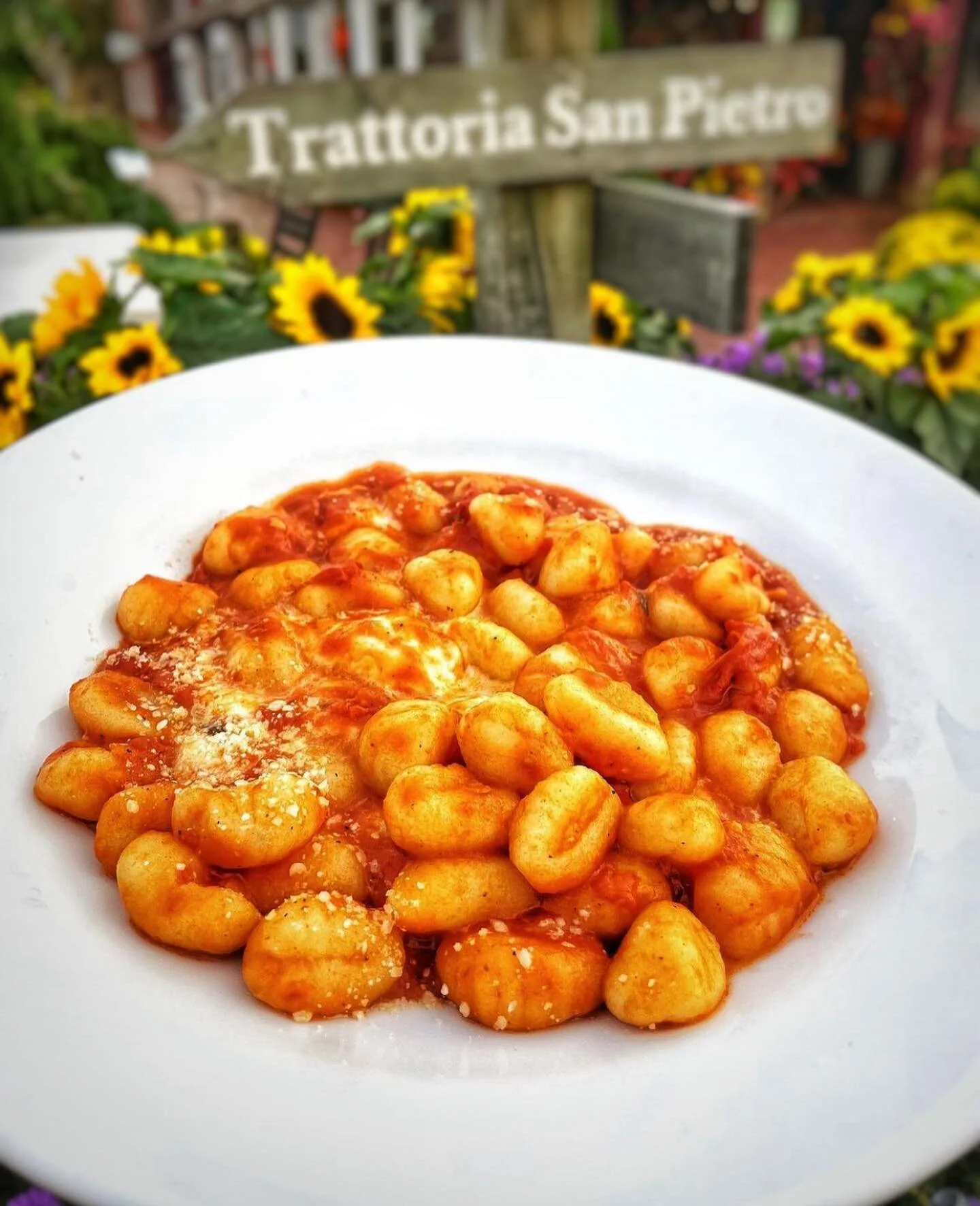 Gnocchi Sorrentina with the Trattoria San Pietro sign